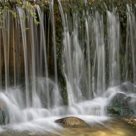 Photo from Unsplash (waterfall stream).