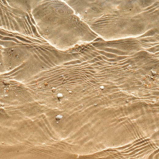 Photo from Unsplash (sunlit water ripples).