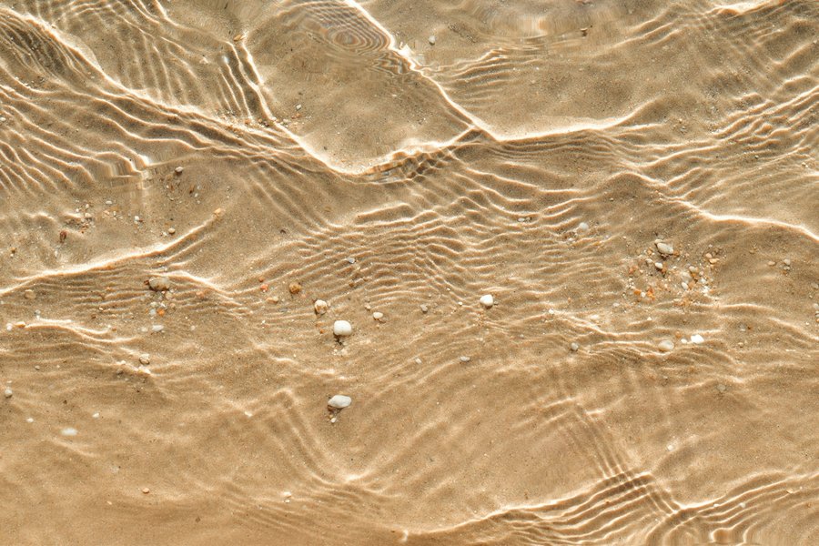 Photo from Unsplash (sunlit water ripples).