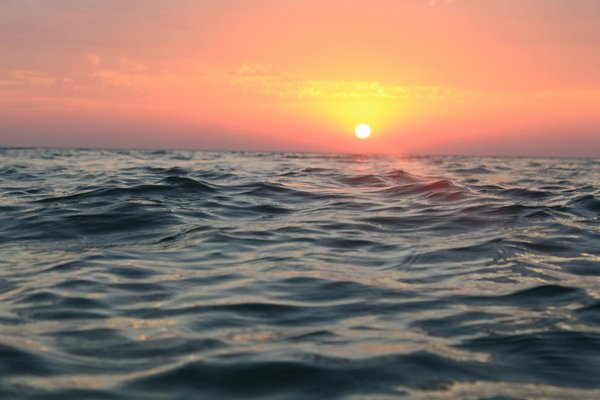 Photo from Unsplash (sunset over ocean).